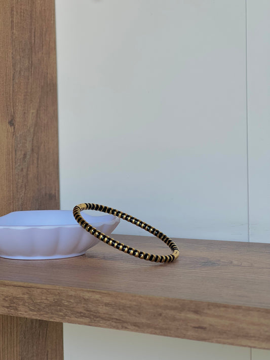 Black and gold bangle bracelet
